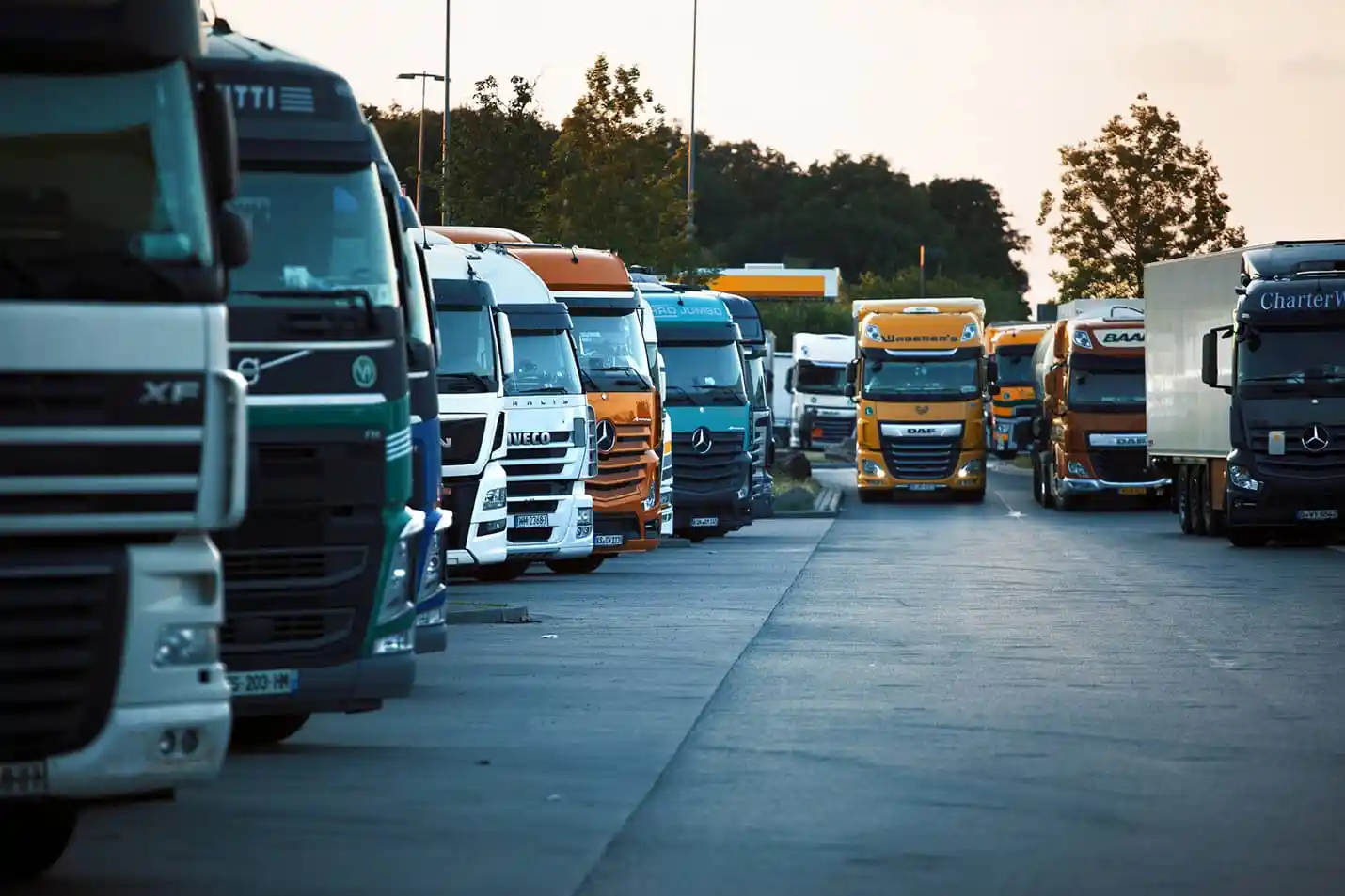 A lineup of commercial trucks ready for fleet cleaning
