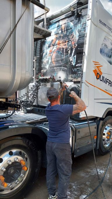Chris washing a commercial vehicle by hand