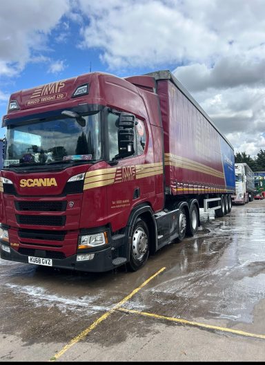 Red commercial truck after a professional wash